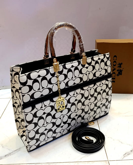 Elegant Coach Handbag – White & Black Signature Tote with Gold Accent Chain